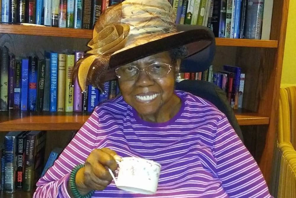 Resident having tea at Victory Centre of Sierra Ridge 