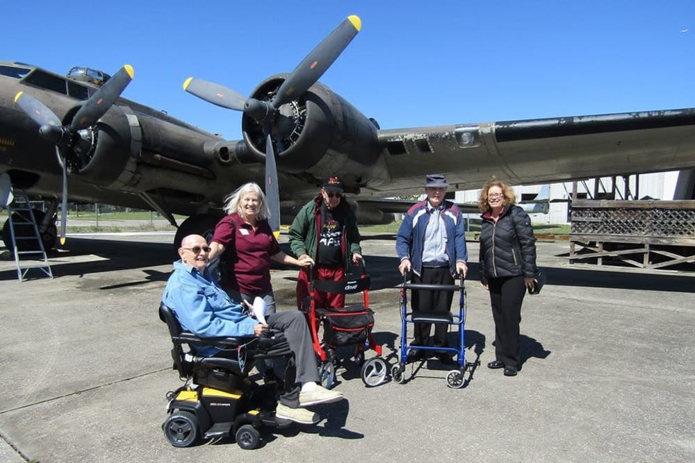 Residents by an airplane at Azpira at Windermere in Windermere, Florida | Pathway to Living
