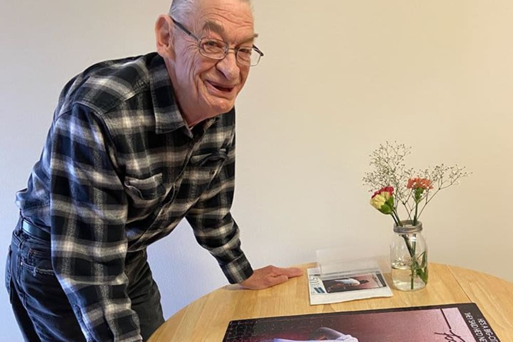 Resident working on puzzle at Victory Centre of Joliet