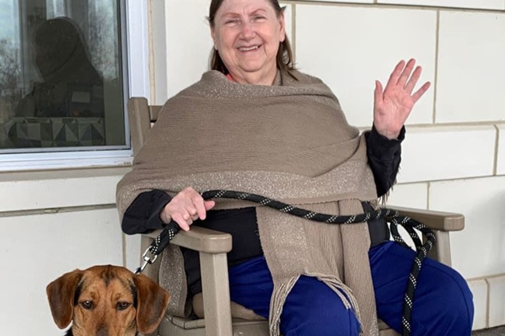 Resident with dog at Oak Hill Supportive Living Community in Round Lake Beach, Illinois