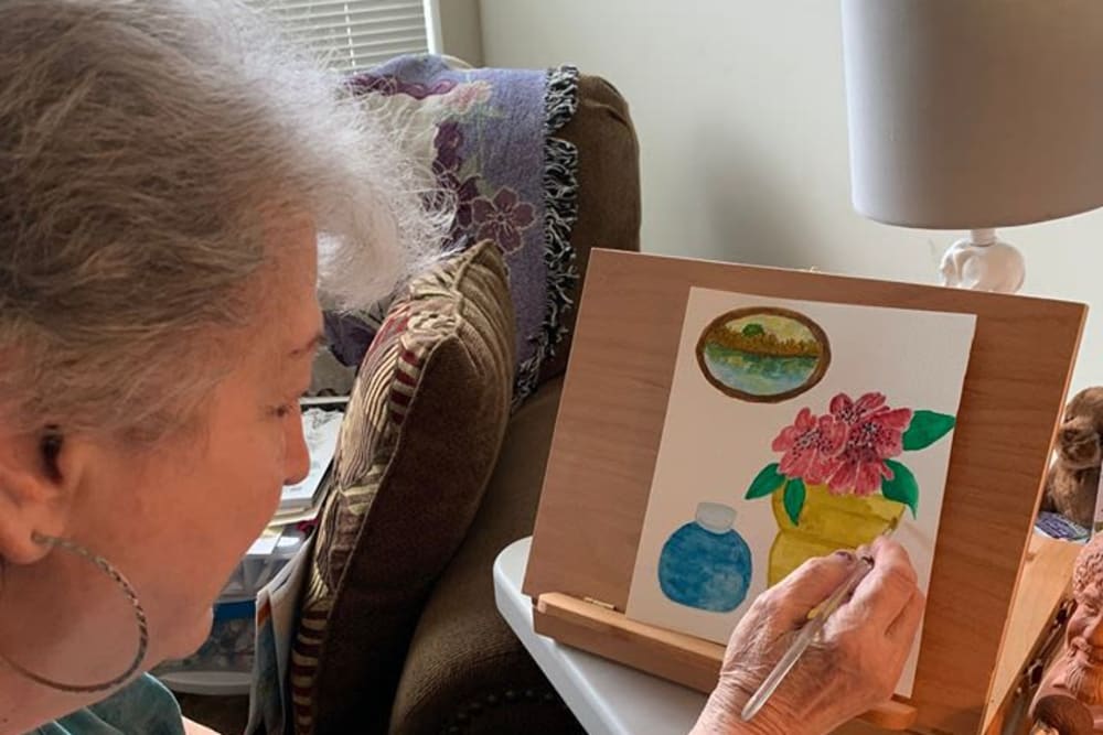 Resident painting at Oak Hill Supportive Living Community in Round Lake Beach, Illinois