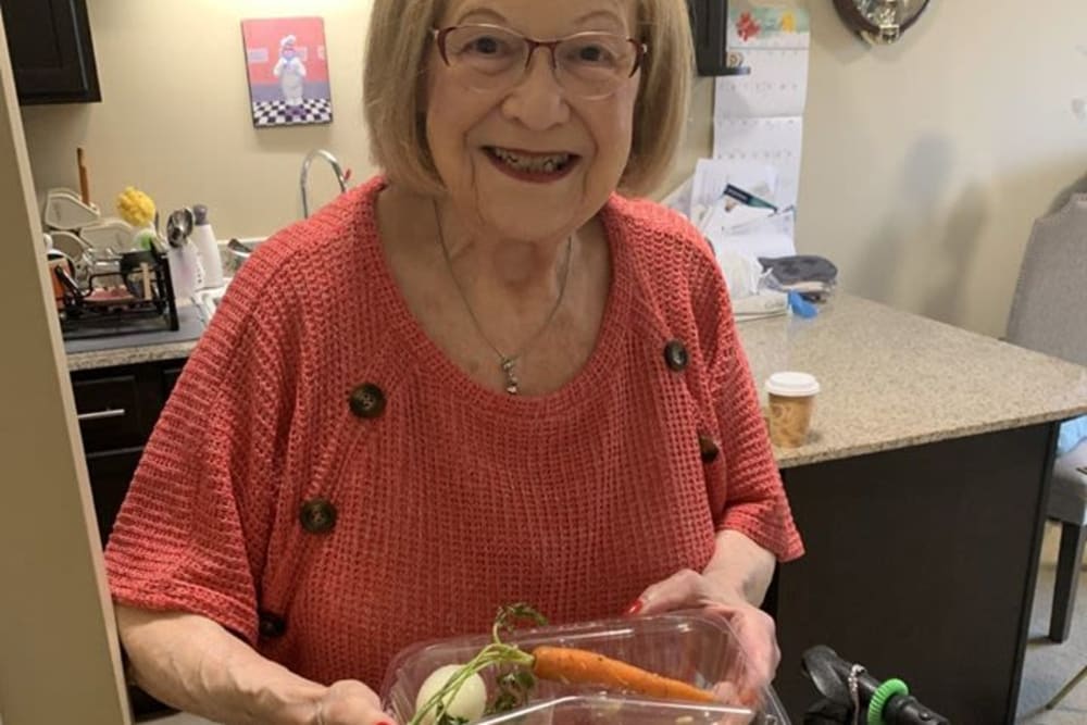 Resident with food at Azpira Place of Lake Zurich in Lake Zurich, Illinois