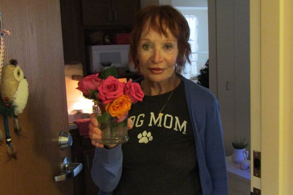 Resident with flowers at Victory Centre of Vernon Hills