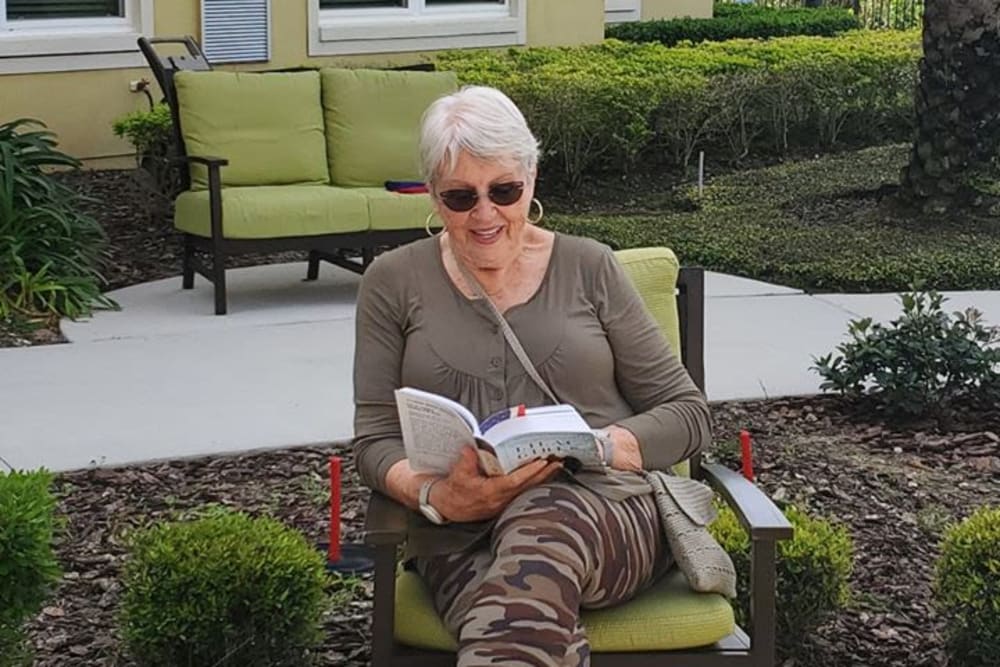 Resident reading at Azpira at Windermere in Windermere, Florida | Pathway to Living