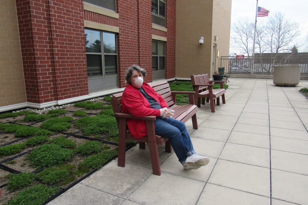 Resident sitting outside at Victory Centre of Galewood