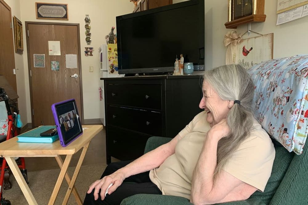 Resident facetiming at Oak Hill Supportive Living Community in Round Lake Beach, Illinois