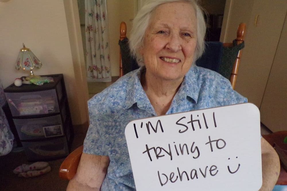 Resident with sign at Victory Centre of Joliet