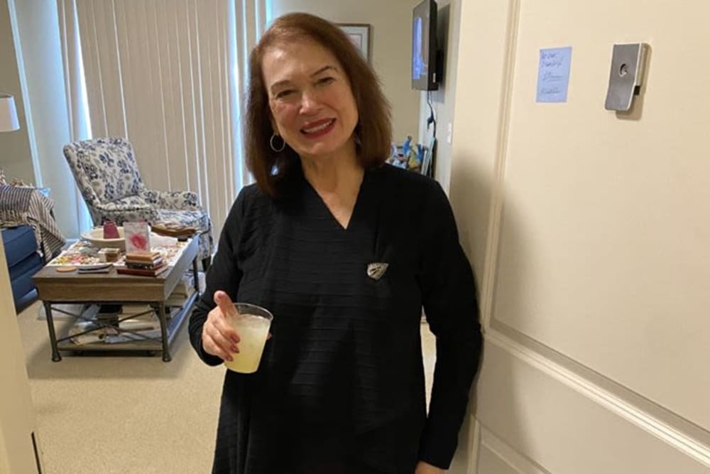 Resident with beverage at Azpira Place of Lake Zurich in Lake Zurich, Illinois