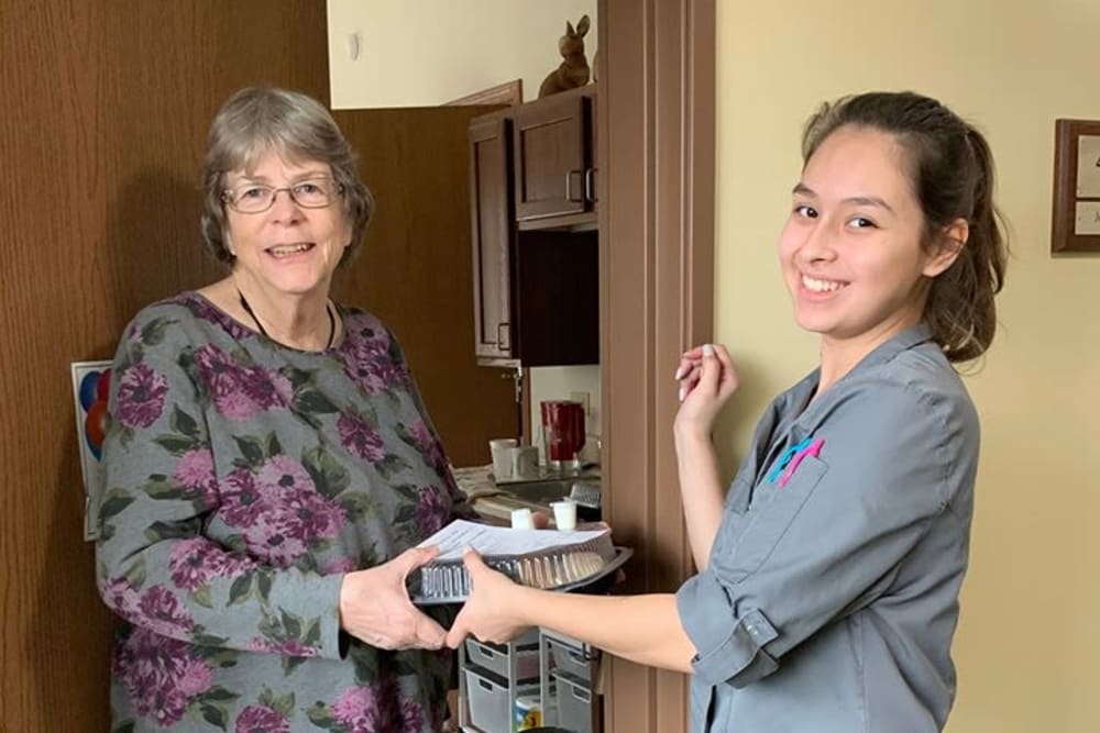 Resident getting food at Oak Hill Supportive Living Community in Round Lake Beach, Illinois