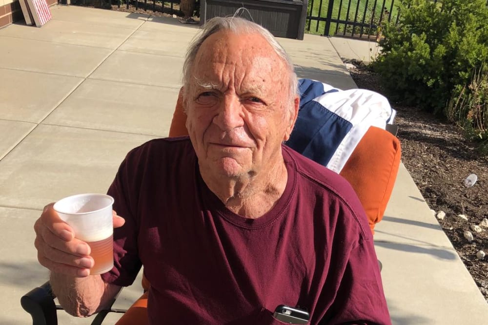 A resident enjoying the outdoors at Aspired Living of Prospect Heights in Prospect Heights, Illinois. 