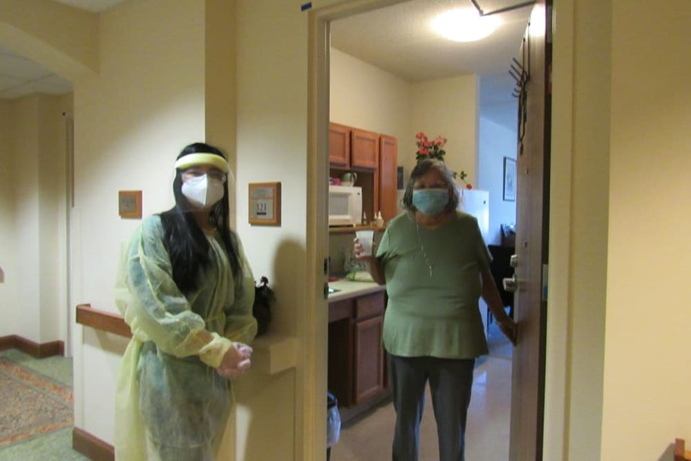 Employee checking in on resident at Victory Centre of Galewood