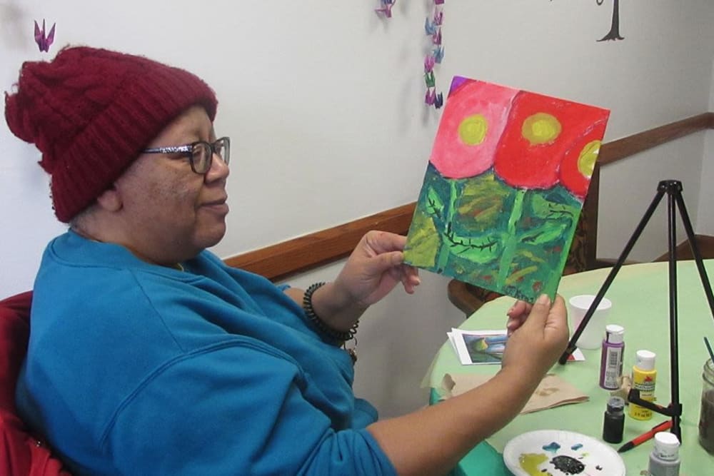 Resident painting at Victory Centre of Roseland 