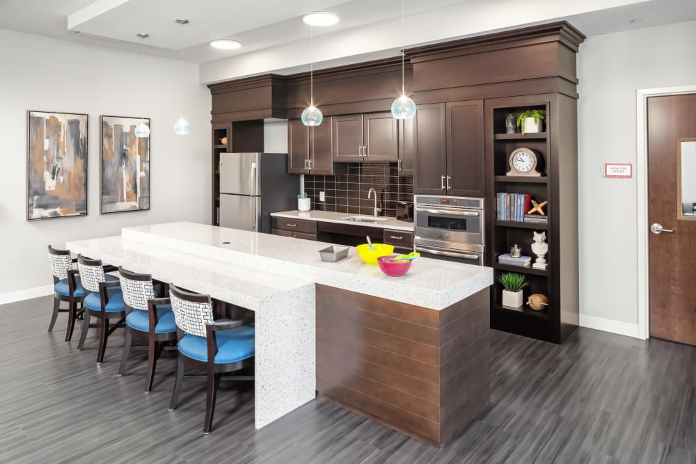 Upscale cafe kitchen with a serving bar and hardwood floors at Aspired Living of La Grange in La Grange, Illinois