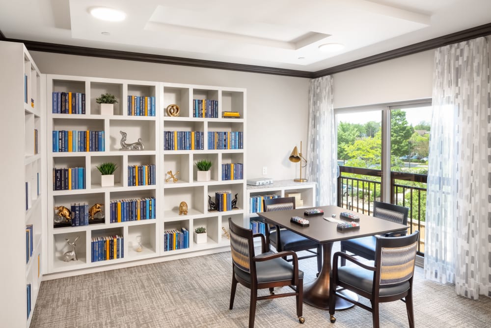 Quiet reading room with several bookshelves at Aspired Living of La Grange in La Grange, Illinois