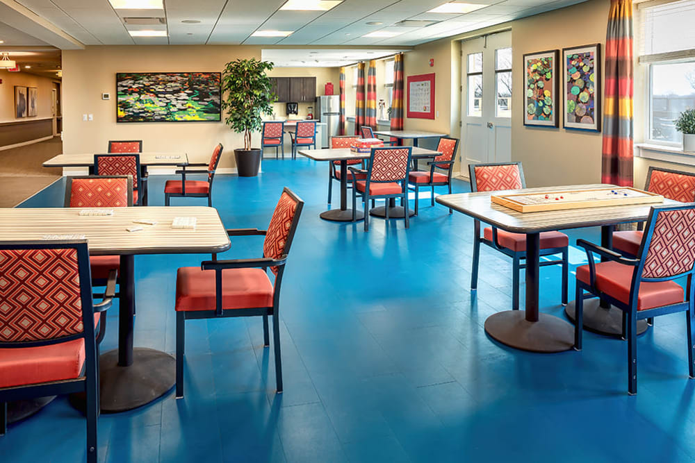 seating area with tables and chairs