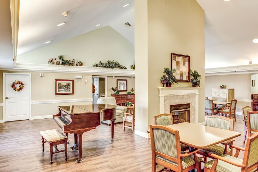 Wood accented community dining area complete with piano at Carriage Court of Washington Court House in Washington Court House, Ohio