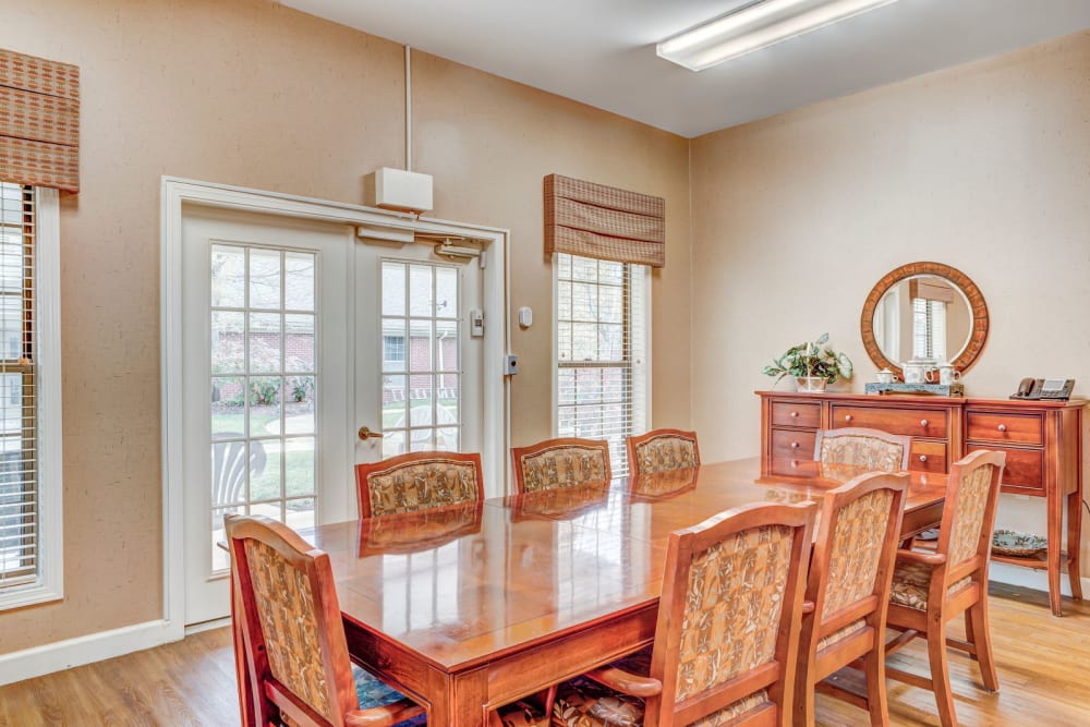 Brightly lit dining area with wood accents at Carriage Court of Lancaster in Lancaster, Ohio