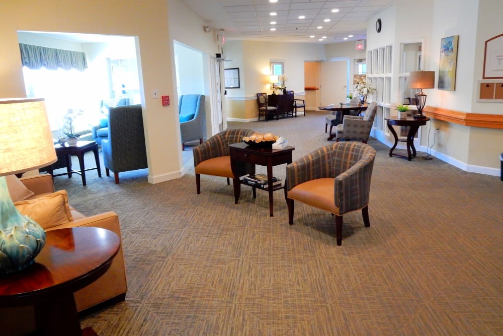 Elegant sitting area with armchairs and bright lighting at Carriage Court of Grove City in Grove City, Ohio