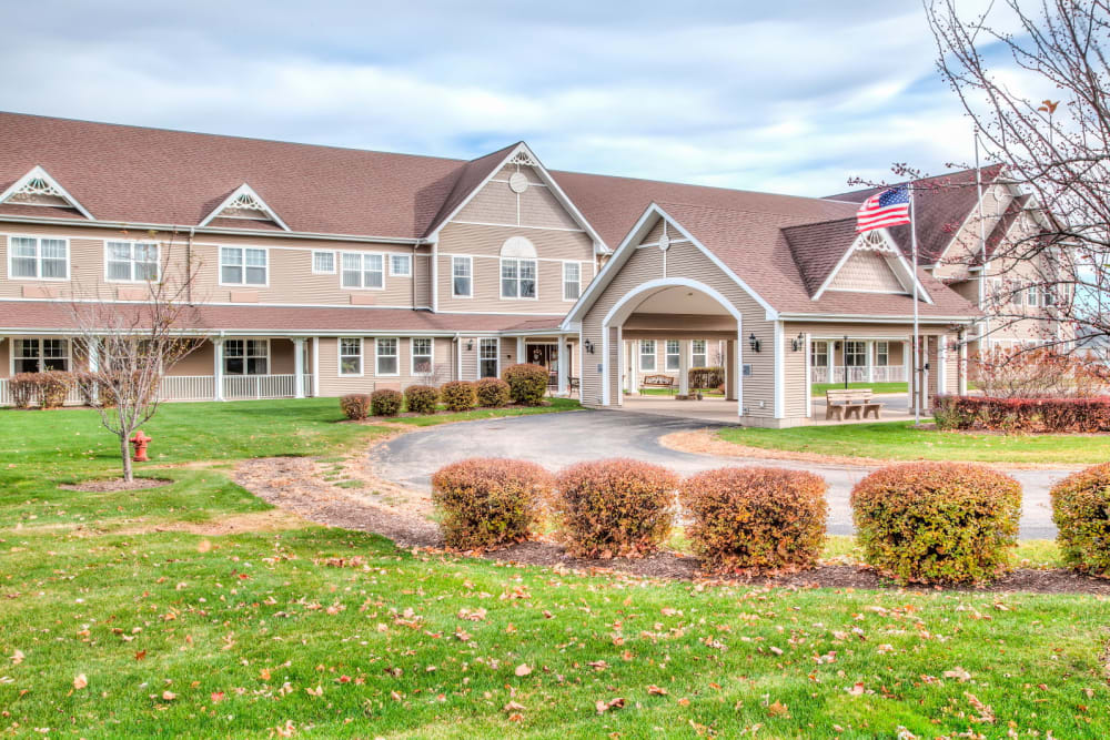 Impressive outside entrance complete with grassy expanse at Grand Victorian of Sycamore in Sycamore, Illinois