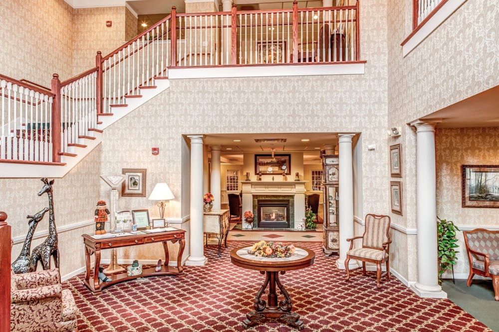 Elegant front entrance with wood accents at Grand Victorian of Sycamore in Sycamore, Illinois