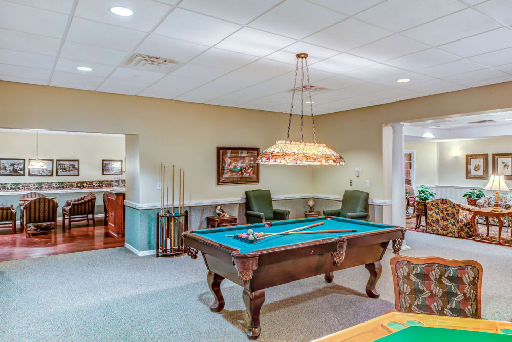 Game room complete with pool tables at Grand Victorian of Rockford in Rockford, Illinois