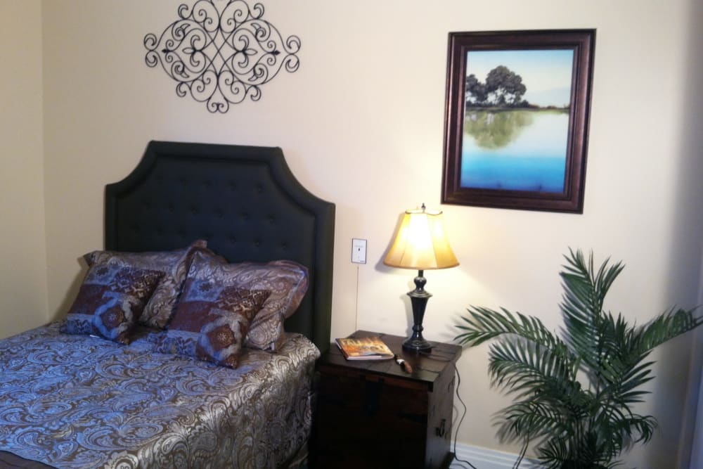 Sleek bedroom furniture at senior living apartment at Brookstone Estates of Charleston in Charleston, Illinois.