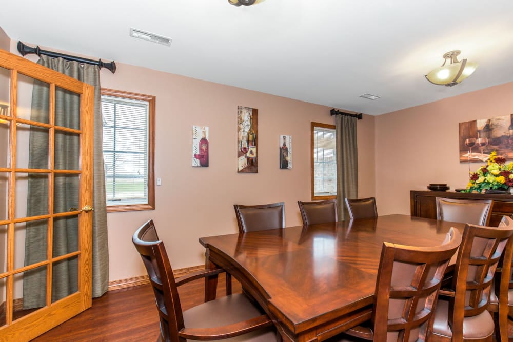 Dining area with wood accents at Brookstone Estates of Tuscola in Tuscola, Illinois