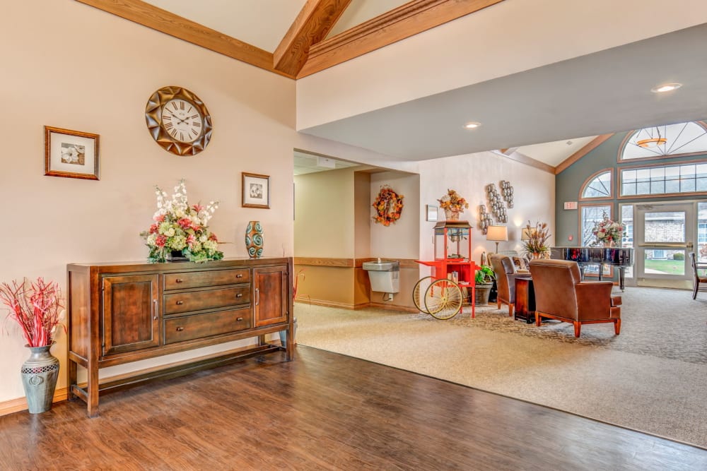 Sunny and spacious common area with wood accents at Brookstone Estates of Tuscola in Tuscola, Illinois