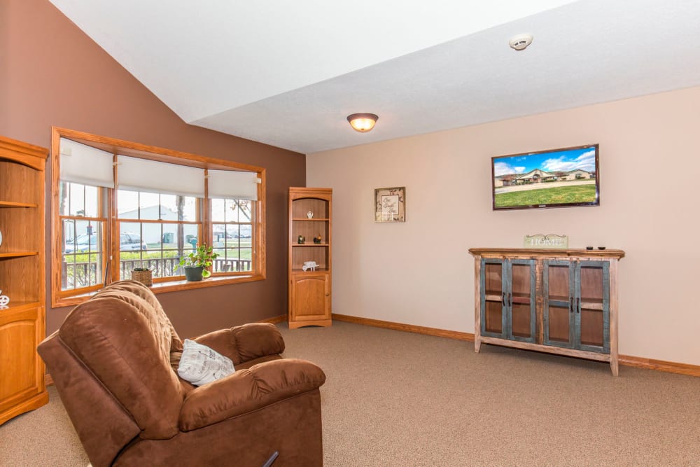 Sitting room with large window at Emerald Glen of Olney in Olney, Illinois