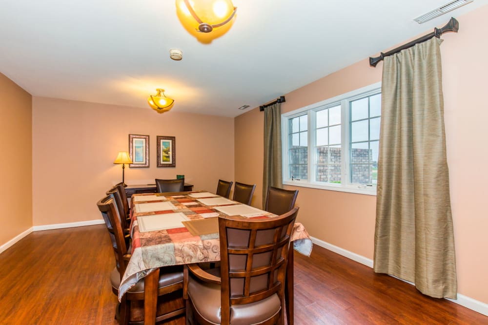 Dining room with hardwood floor at Brookstone Estates of Olney in Olney, Illinois