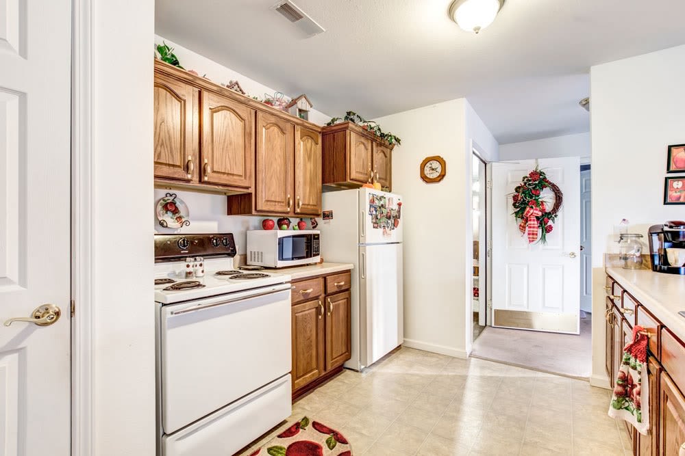 Brightly lit kitchen in senior apartment at Brookstone Estates of Mattoon South in Mattoon, Illinois