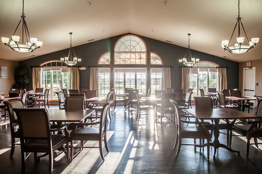 Elegant dining room complete with hardwood floor and chandelier at Brookstone Estates of Mattoon South in Mattoon, Illinois