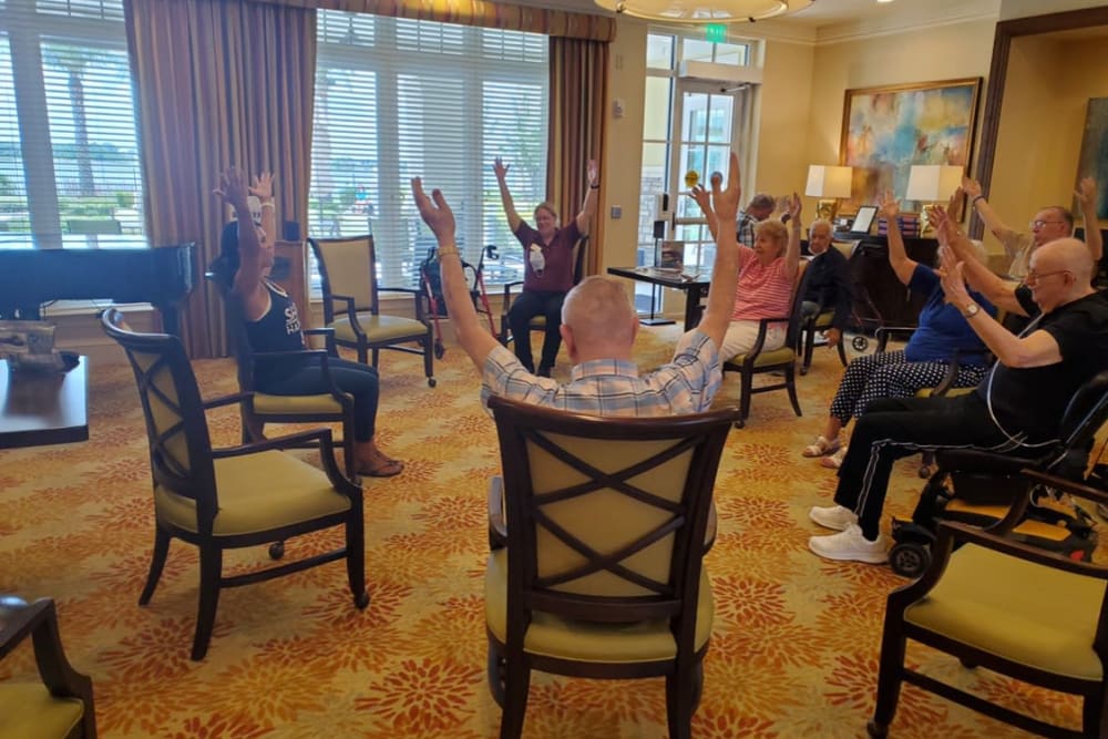 Residents in fitness studio exercising at Azpira at Windermere | Pathway to Living