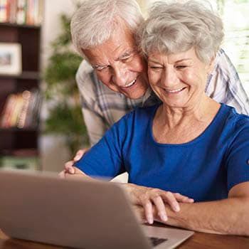 Two residents learning more about assisted living at Grand Victorian of Sycamore in Sycamore, Illinois. 