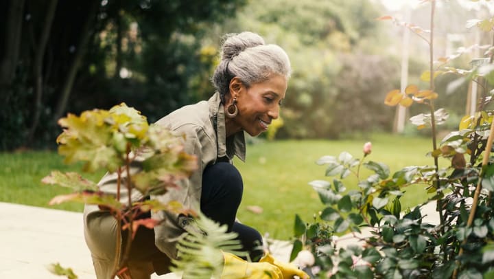 African-American-woman-gardening-in-Orland-Florida-assisted-living-community