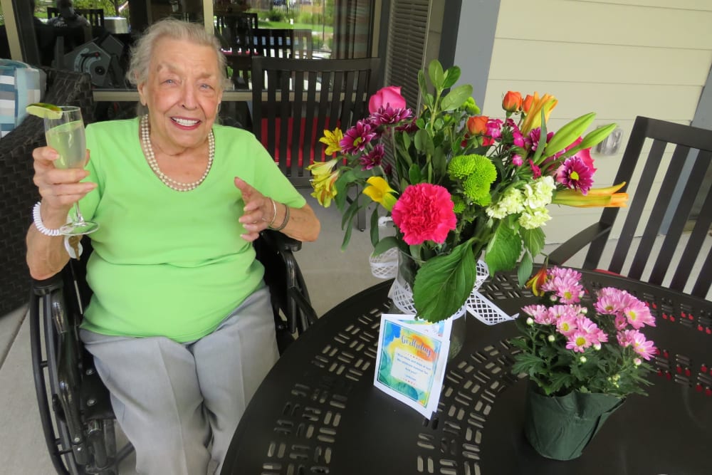 Resident receiving flowers at Aspired Living of La Grange in La Grange, Illinois