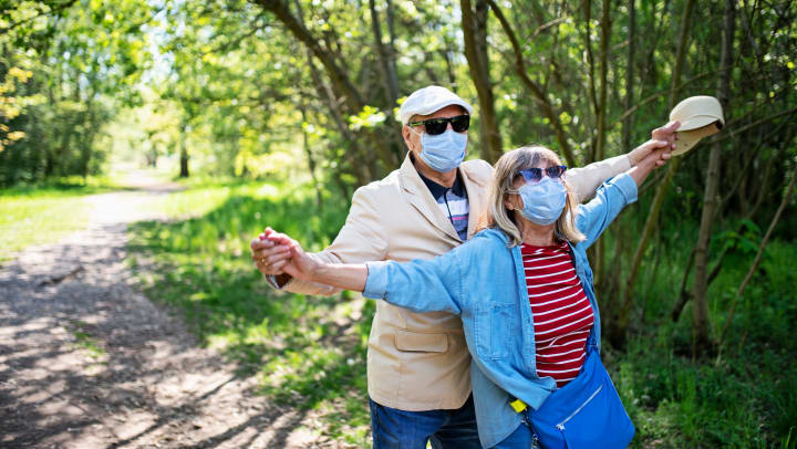 A couple wearing masks