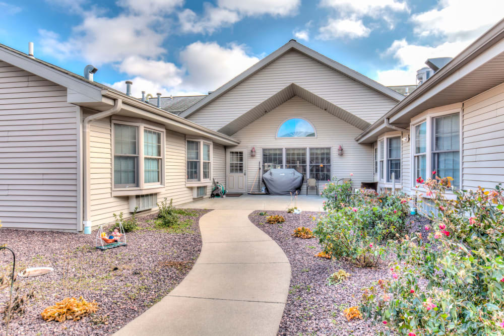 Path leading up to upscale senior living facility at Emerald Glen of Olney in Olney, Illinois