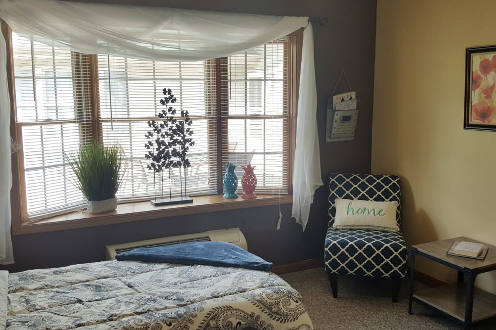Calming bedroom of senior apartment at Brookstone Estates of Paris in Paris, Illinois
