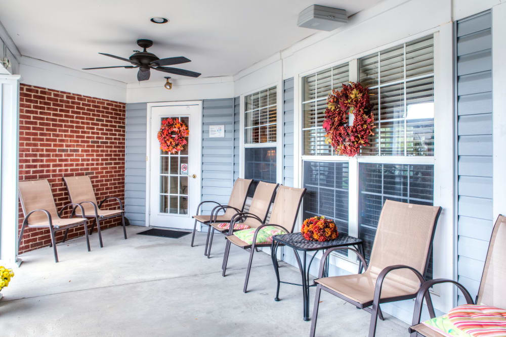 Cheerful porch seating at Carriage Court of Grove City in Grove City, Ohio