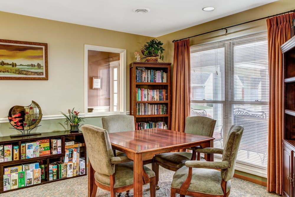 Game and book room with wood accents at Carriage Court of Grove City in Grove City, Ohio