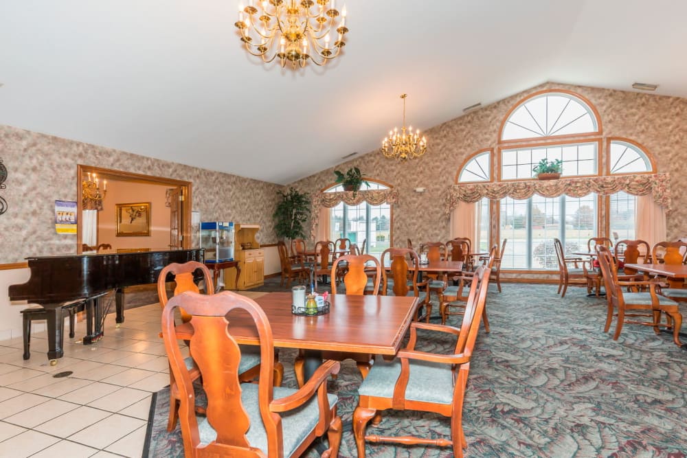 Elegant dining area complete with chandeliers at Brookstone Estates of Paris in Paris, Illinois