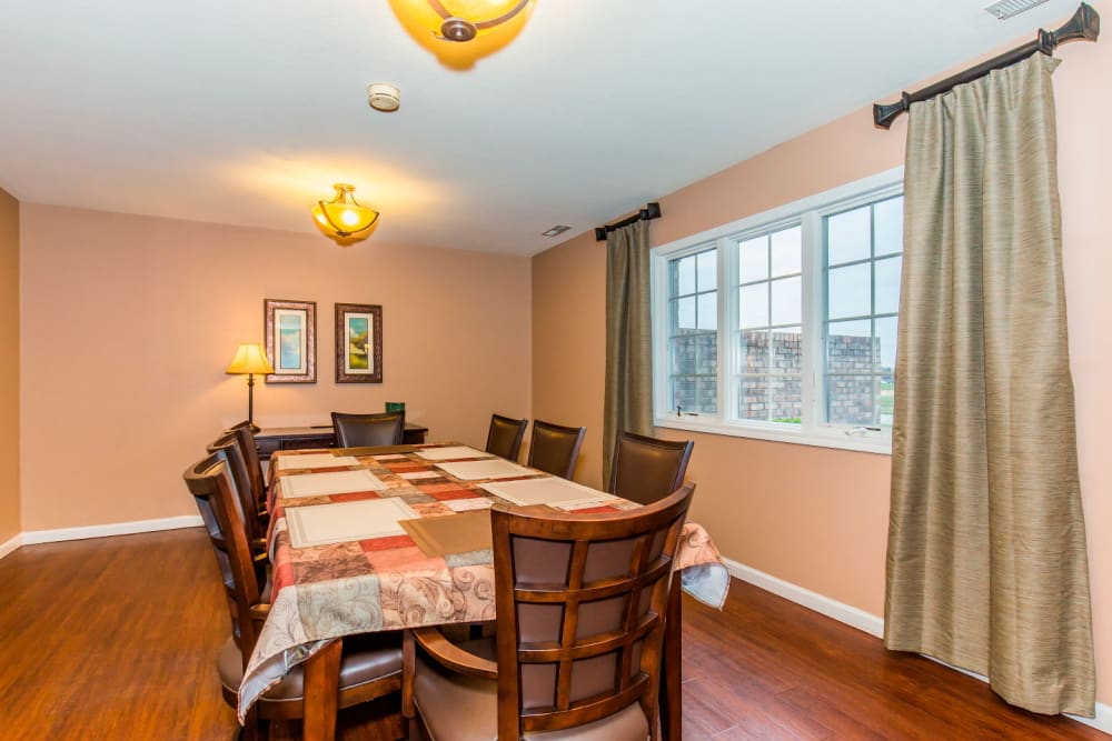 Quaint dining room with hardwood floors at Brookstone Estates of Olney in Olney, Illinois
