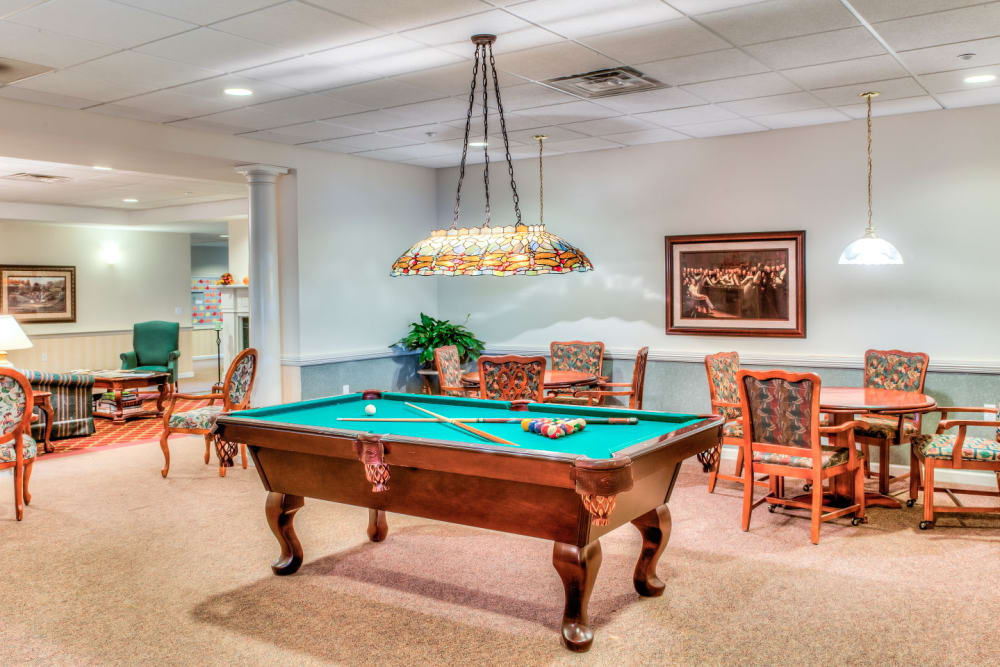 Deluxe billards table with ample game room seating at Grand Victorian of Sycamore in Sycamore, Illinois
