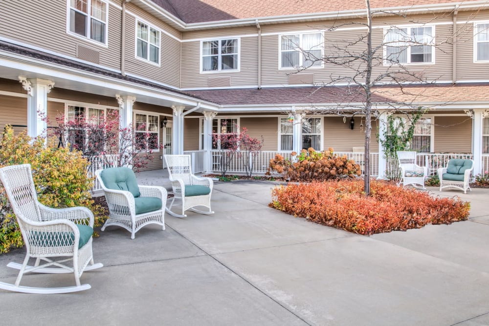Inviting outside courtyard with ample seating at Grand Victorian of Sycamore in Sycamore, Illinois
